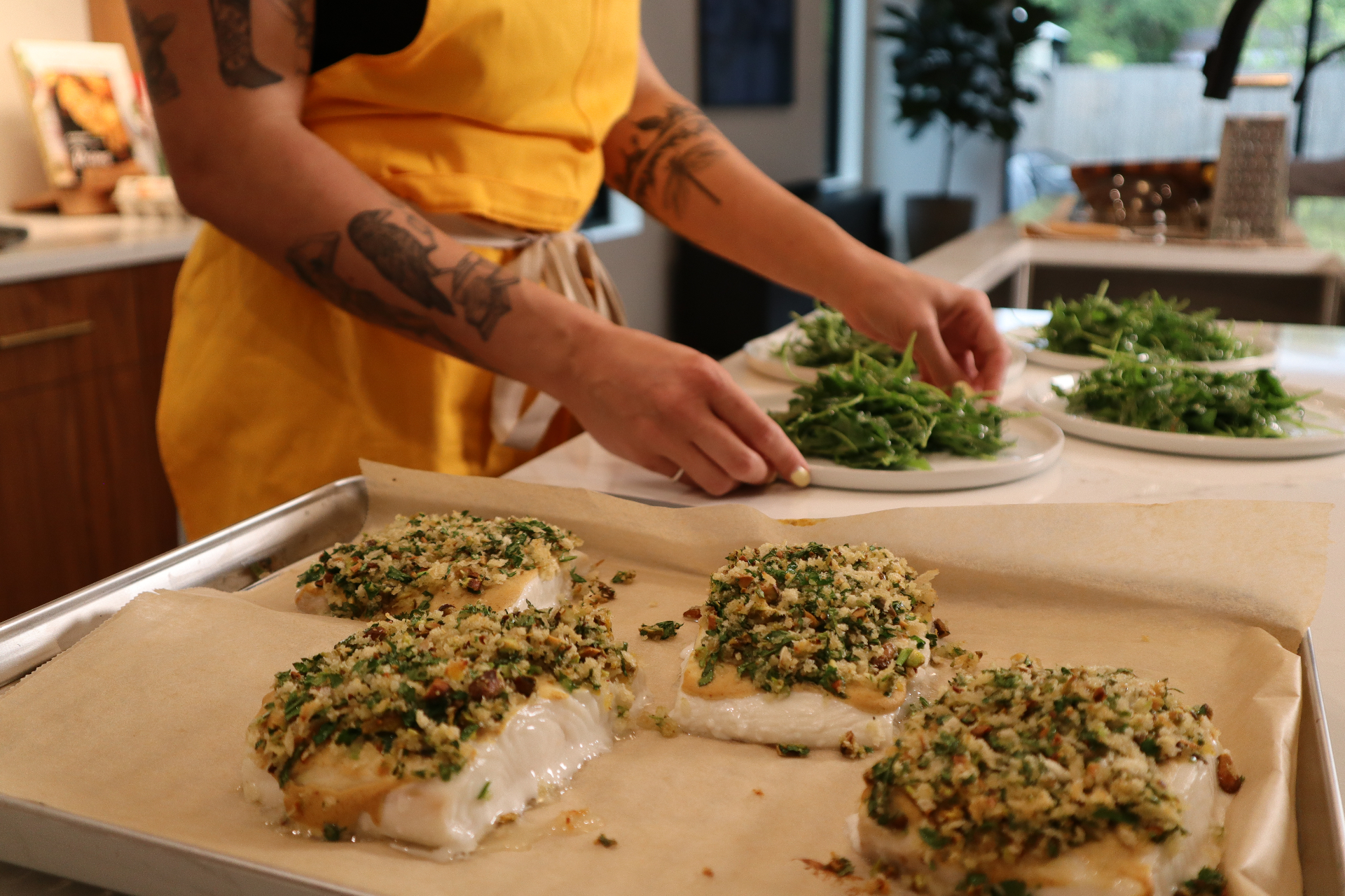 Jean preparing fresh herbs in her kitchen
